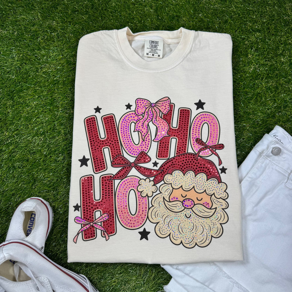 Red and pink HO HO HO Santa and bows spangle design on a cream Comfort Colors tee