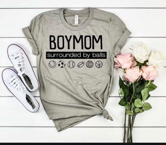 boy mom surrounded by balls