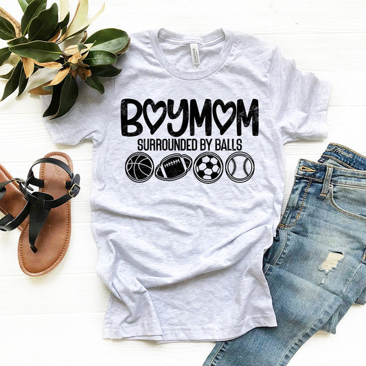 boy mom surrounded by balls heart