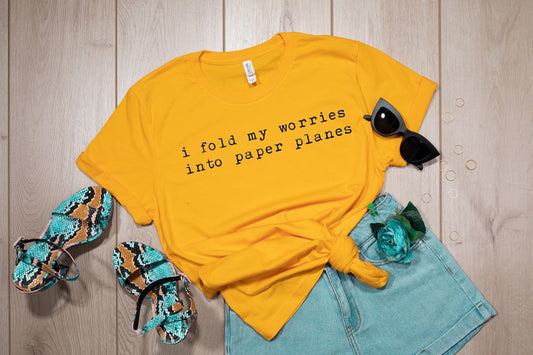 i fold my worries into paper planes