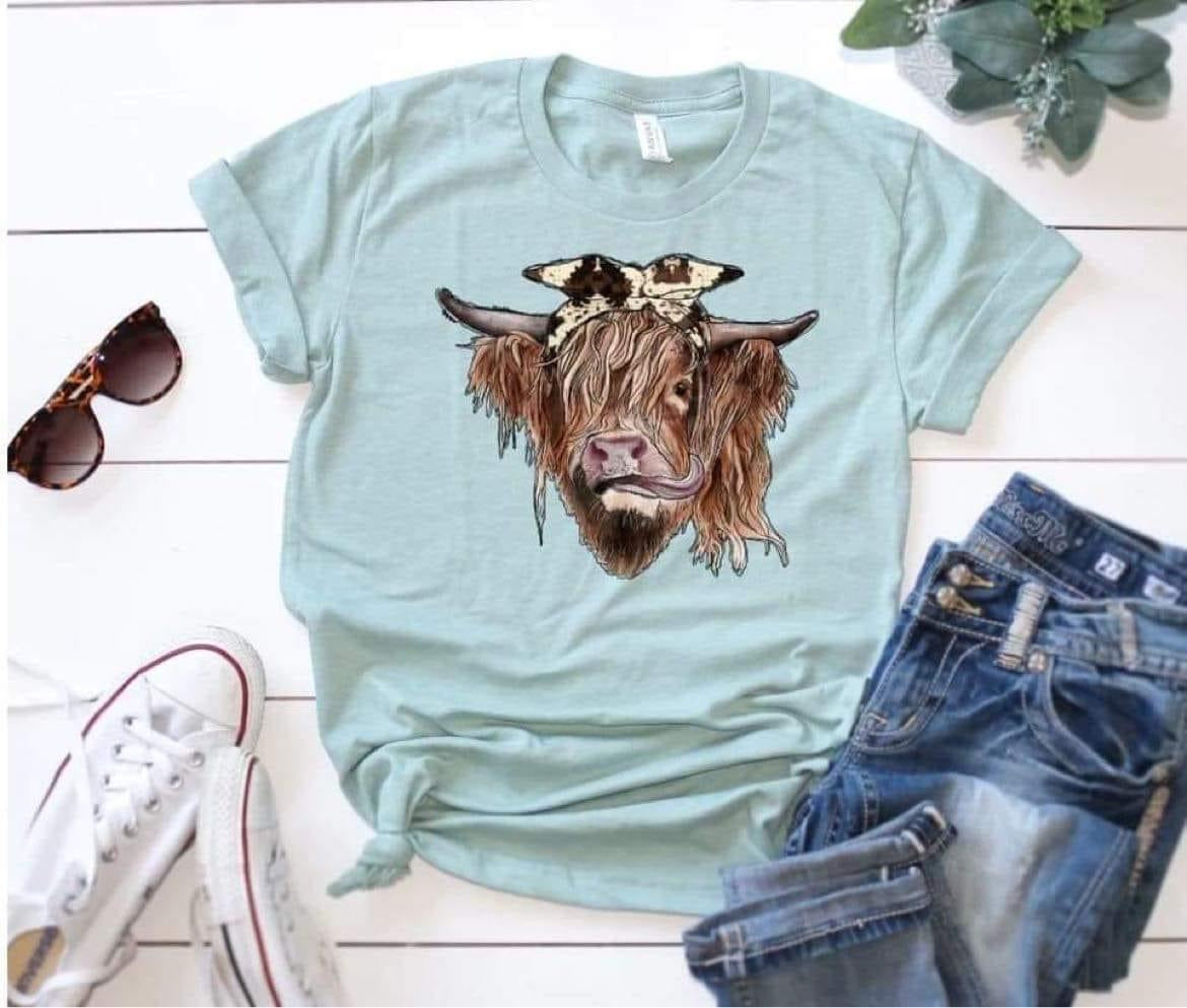 highland cow with cow print bow